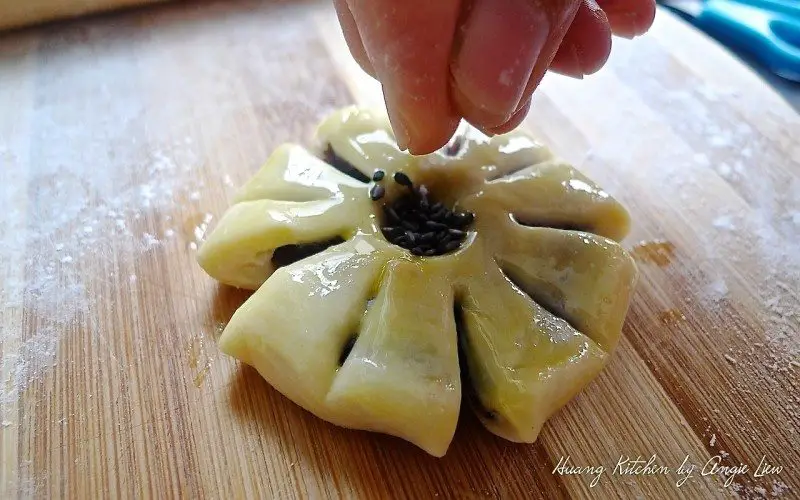 Plum Blossom Mooncakes - decorate with sesame seeds