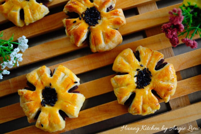Flaky Plum Blossom Mooncakes with Red Bean Paste Filling Recipe by Huang Kitchen - Top down view of mooncakes on board