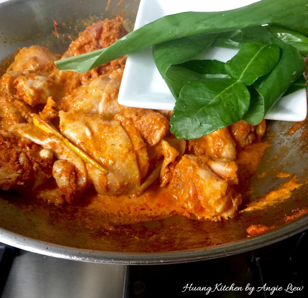 Traditional Malaysian Chicken Rendang recipe - add turmeric kaffir leaves