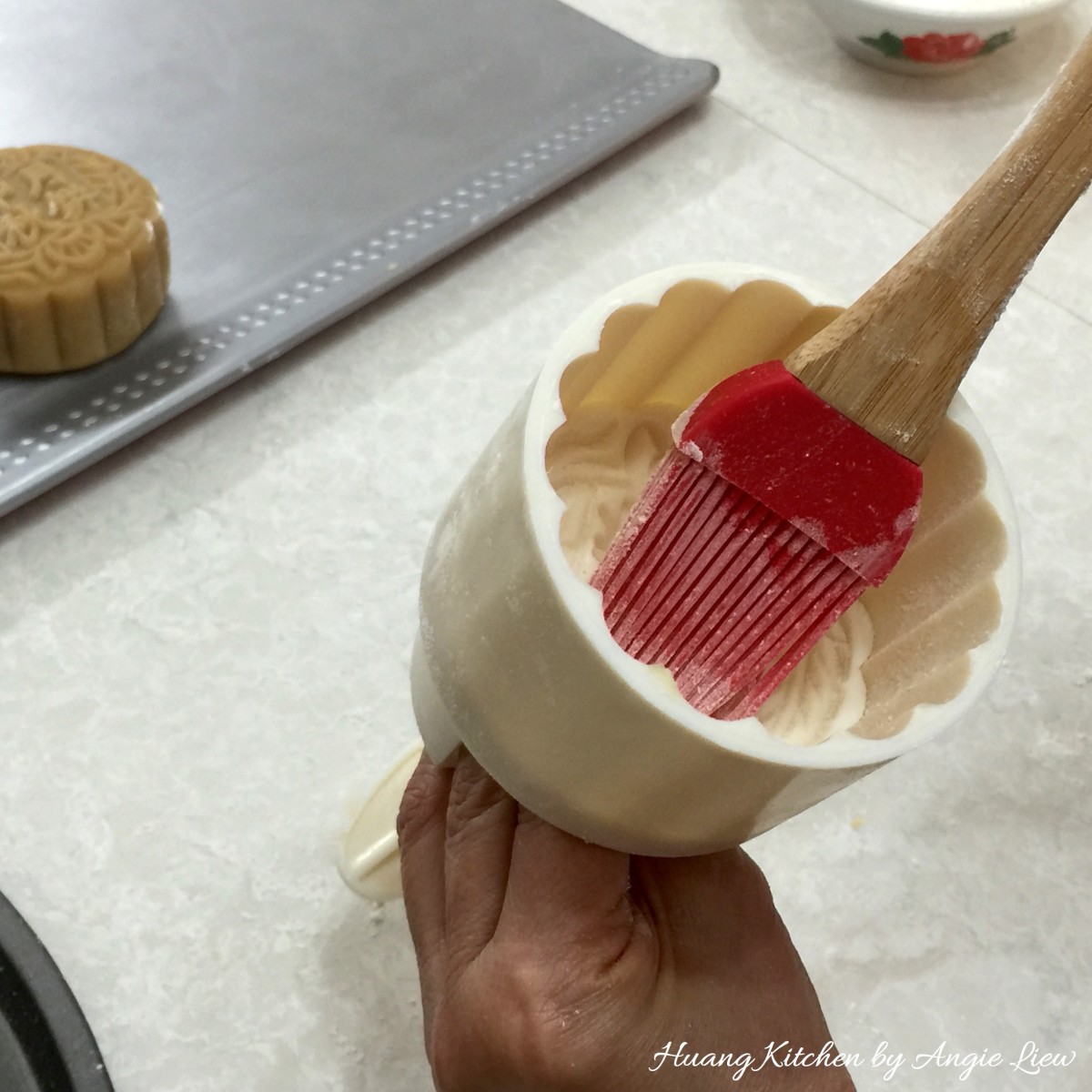 Traditional Baked Mooncakes Recipe by Huang Kitchen - Brush plastic mooncake mould press with flour
