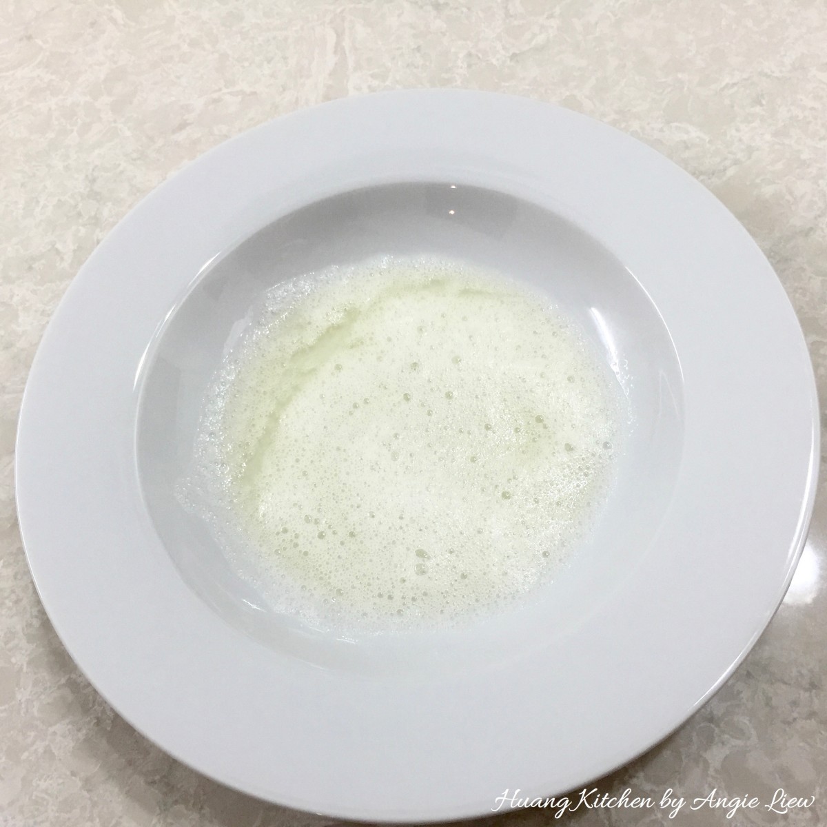 Christmas Thumbprint Cookies Recipe - egg white in shallow bowl