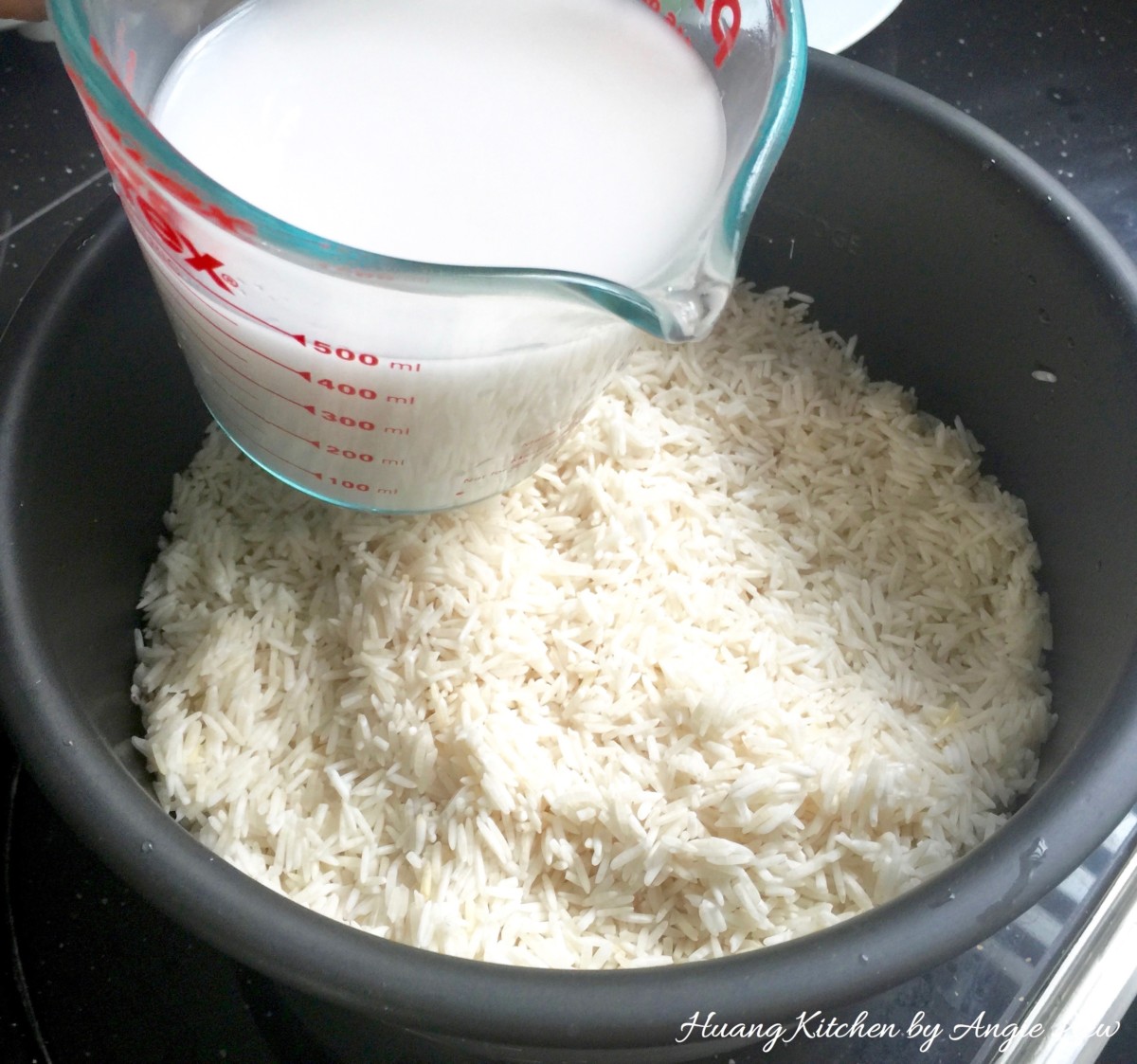 Nasi Lemak Recipe (Coconut Milk Steamed Rice) - pour coconut milk