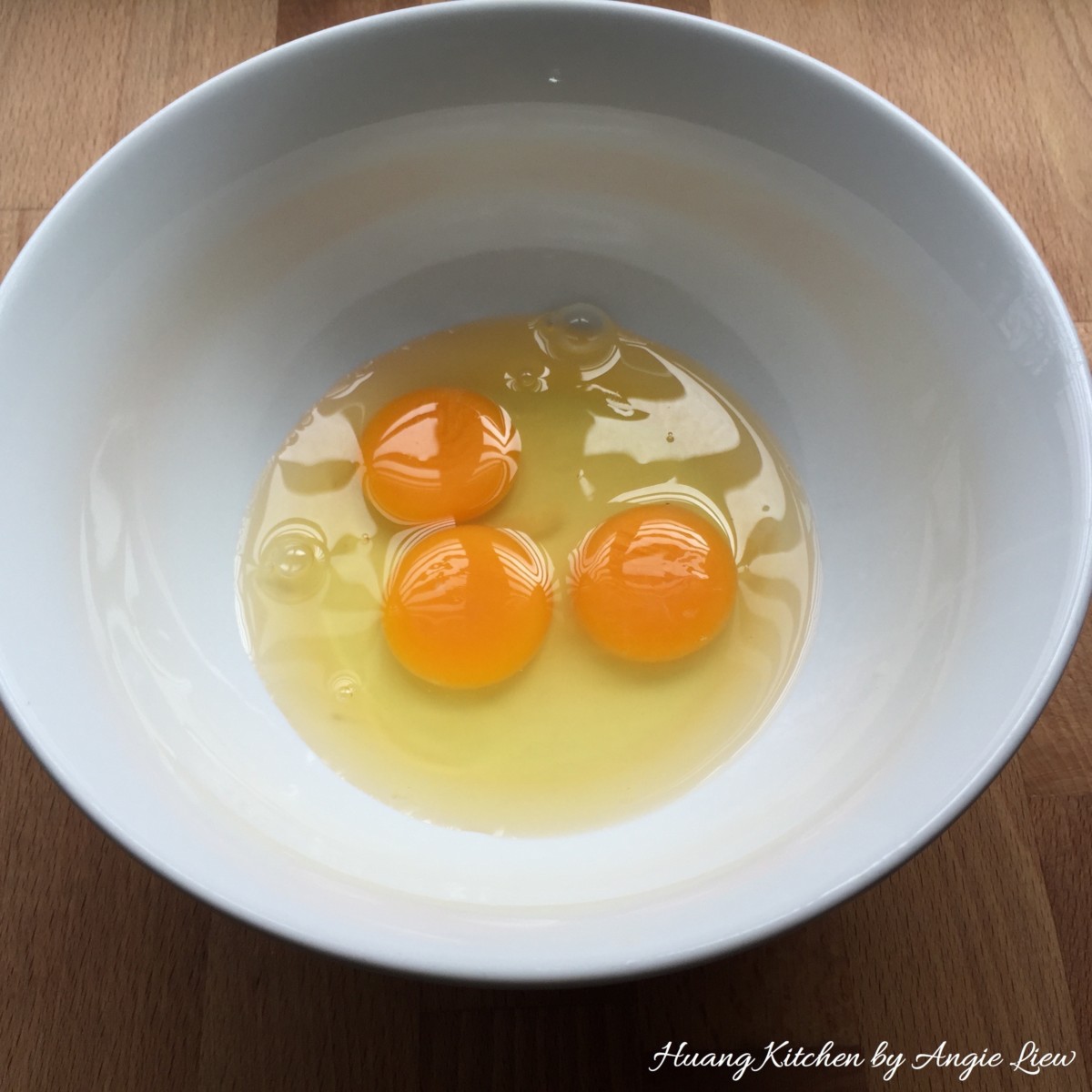 Crack eggs in bowl.