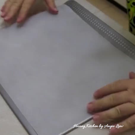 Line baking sheet with parchment paper.
