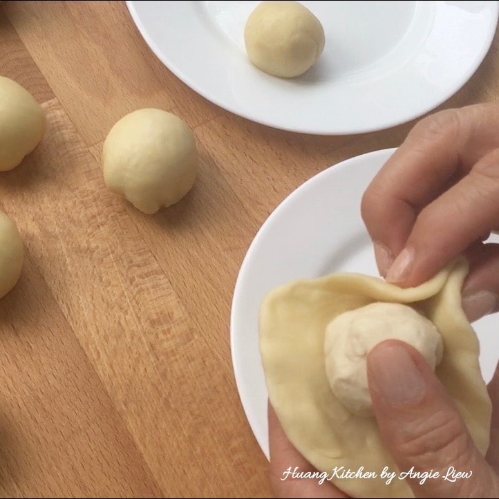 Wrap oil dough in water dough.