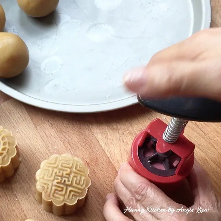 Press with mooncake mould.