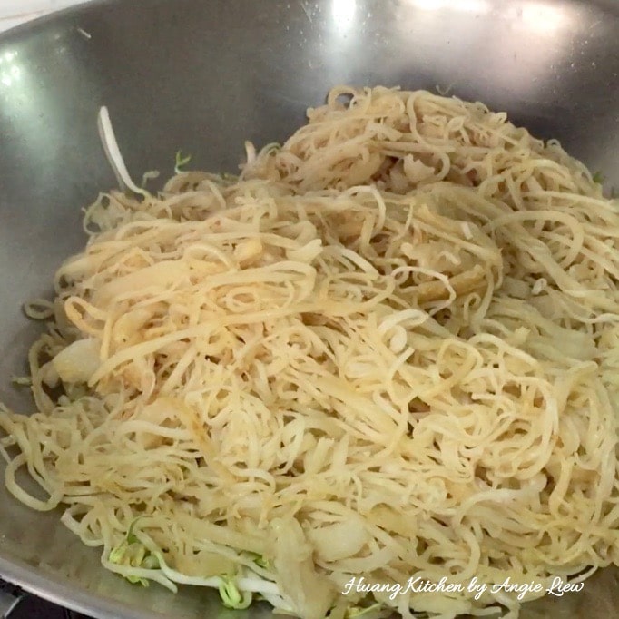 Fry till noodles turn slightly brown.