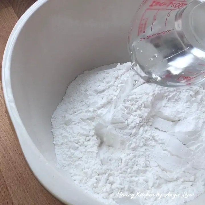 Add boiling water to flour.