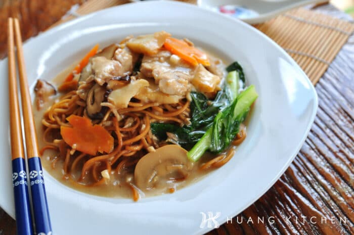 Egg Noodles With Mushroom Soup Recipe by Huang Kitchen - Noodles served on dish with chopsticks