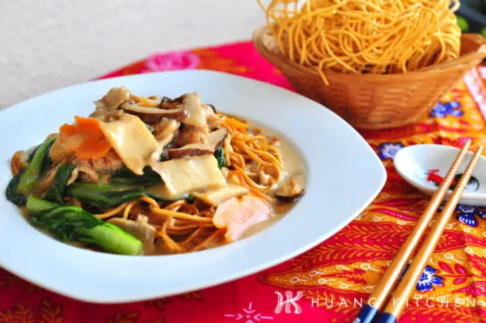Egg Noodles With Mushroom Soup Recipe by Huang Kitchen - Noodles with chopstick spoon and basket of yee mee