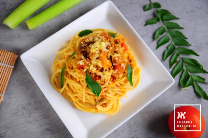 Spaghetti with Curry Meat Sauce (Malaysian Style Bolognese Pasta) Recipe by Huang Kitchen - Pasta in square plate with curry leaves celery tomato