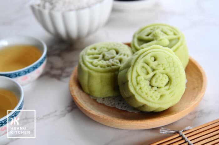 Ondeh Ondeh Snow Skin Mooncakes Recipe (Bing Pi) by Huang Kitchen - Close up of mooncakes with chinese tea and fresh grated coconut in the background