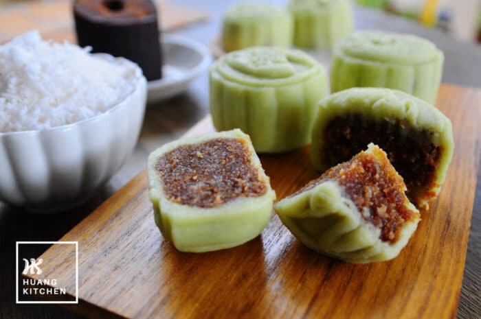 Ondeh Ondeh Snow Skin Mooncakes Recipe (Bing Pi) by Huang Kitchen - Cut wedges of mooncake with grated fresh coconut and palm sugar in background