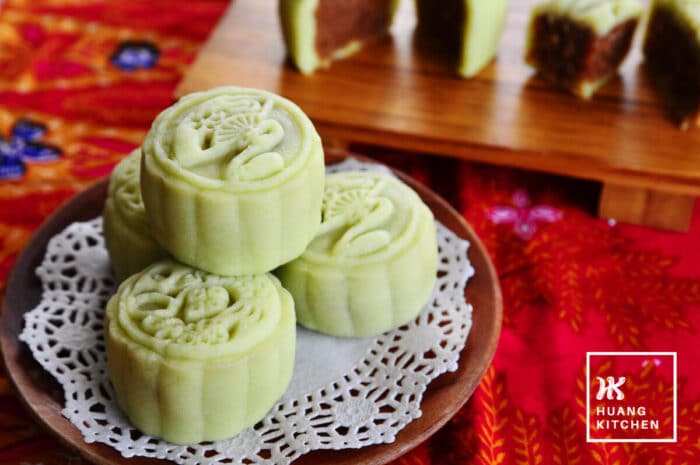 Ondeh Ondeh Snow Skin Mooncakes Recipe 椰丝球冰皮月饼食谱 by Huang Kitchen - mooncake close up with cut wedges and batik background
