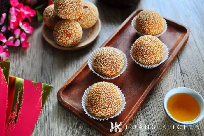 Deep Fried Nian Gao Sesame Balls Recipe by Huang Kitchen - on wooden plate chinese tea